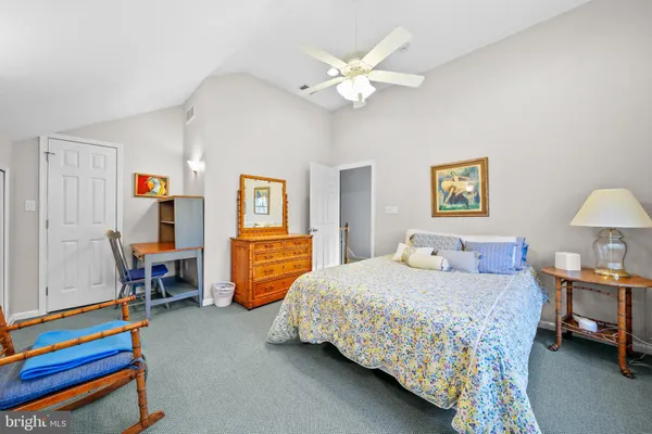 a bedroom with bed and a window