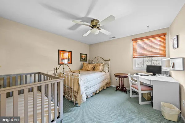 a bedroom with furniture and a flat screen tv
