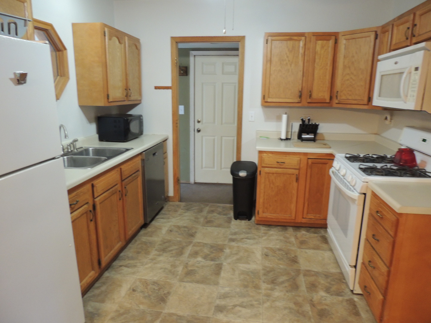 1369 Argyle Road LaSalle, IL 61301 - Photo 6 of 14 a kitchen with stainless steel appliances granite countertop a sink stove and refrigerator