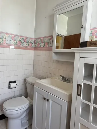 a bathroom with a sink a toilet and a bathtub