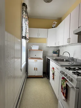 a kitchen with a stove and a sink