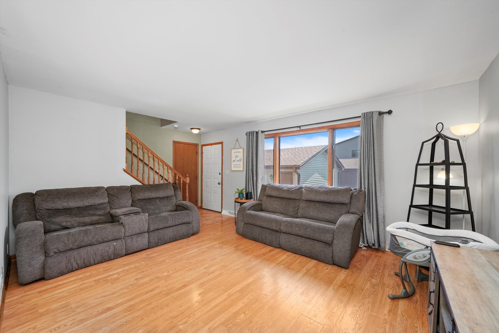 316 Circlegate Road New Lenox, IL 60451 - Photo 7 of 24 a living room with furniture and a large window