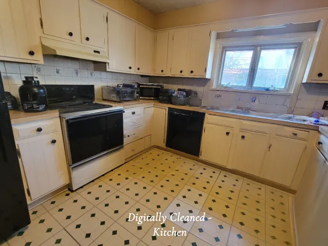 a kitchen with a sink a stove and cabinets
