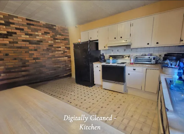 a kitchen with stainless steel appliances a refrigerator and a stove