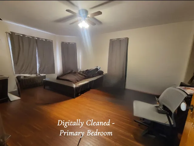 a view of a room with furniture and wooden floor