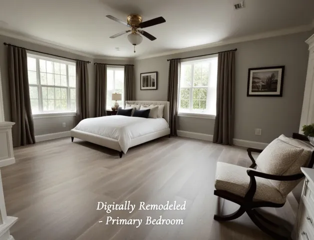 a living room with a bed furniture and a window