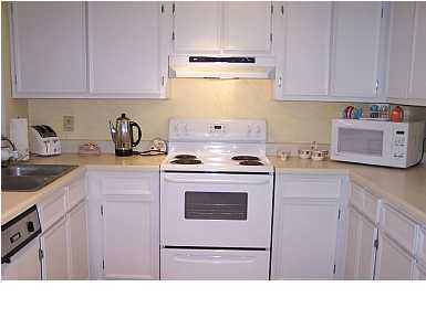 63 Sandy Lane, Unit 101 Santa Rosa Beach, FL 32459 - Photo 7 of 11 a kitchen with cabinets appliances and a sink