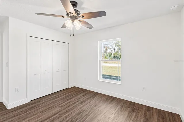 a bathroom with a granite countertop sink and mirror