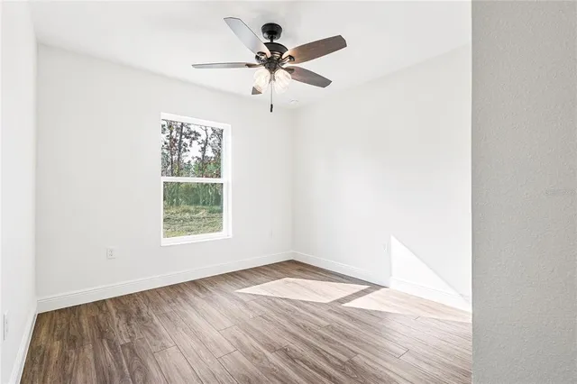 a kitchen with stainless steel appliances granite countertop a sink and a refrigerator