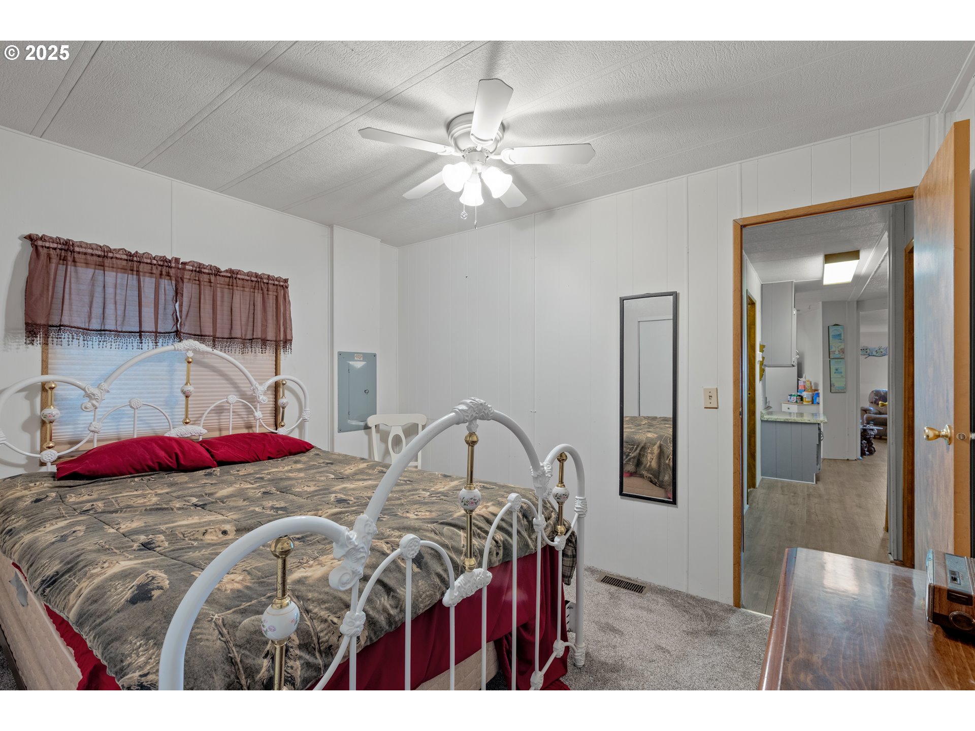 125 Estate Loop Winston, OR 97496 - Photo 26 of 45 a bedroom with a bed and a closet