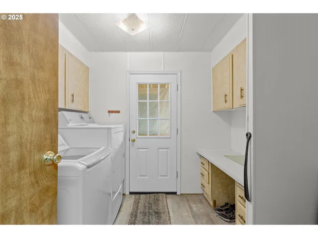 a kitchen with a refrigerator and a sink