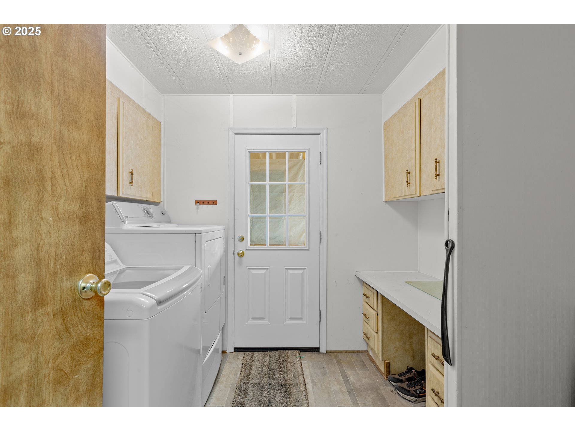 125 Estate Loop Winston, OR 97496 - Photo 28 of 45 a kitchen with a refrigerator and a sink