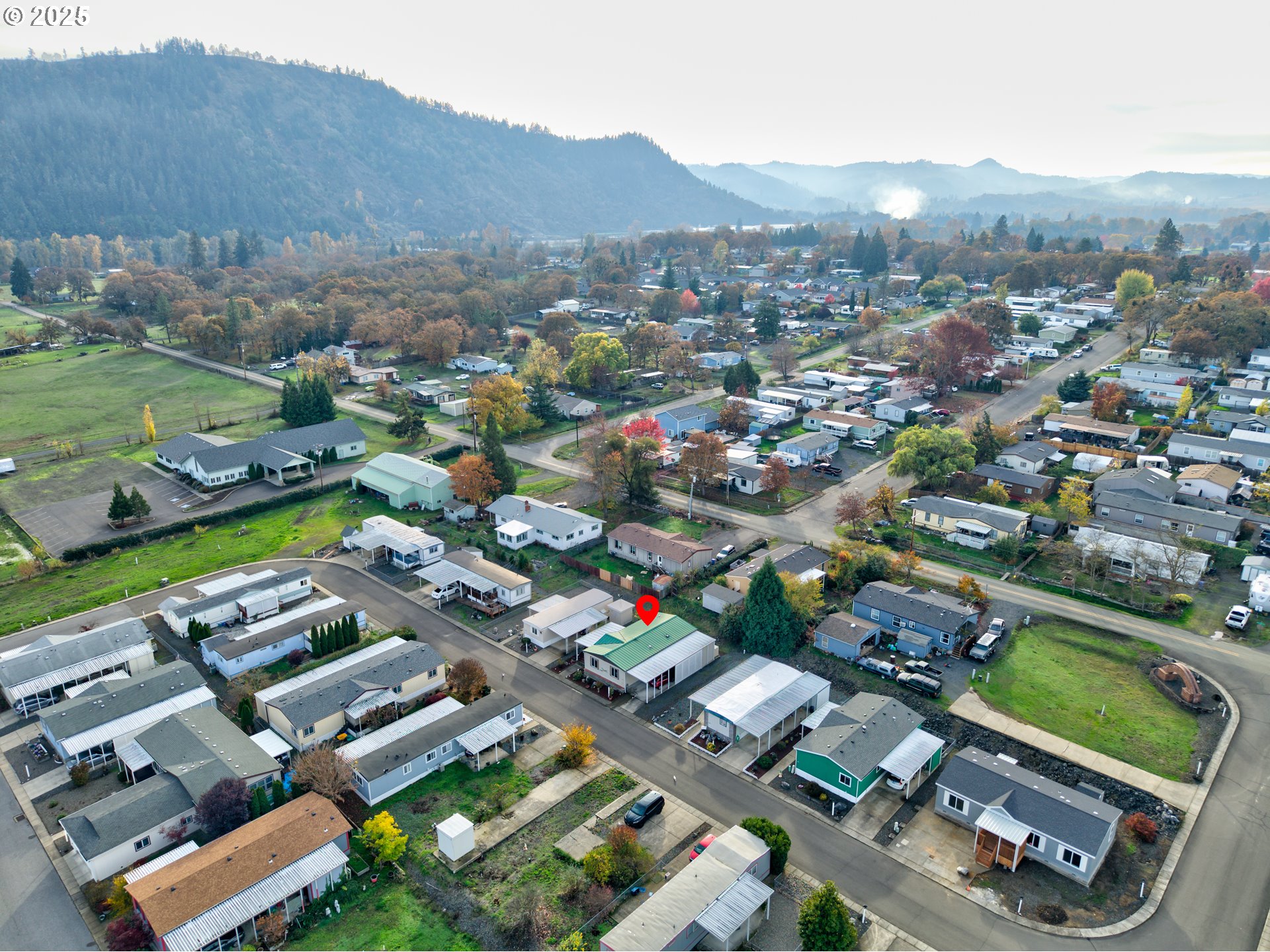 125 Estate Loop Winston, OR 97496 - Photo 35 of 45 an aerial view of residential houses and outdoor space