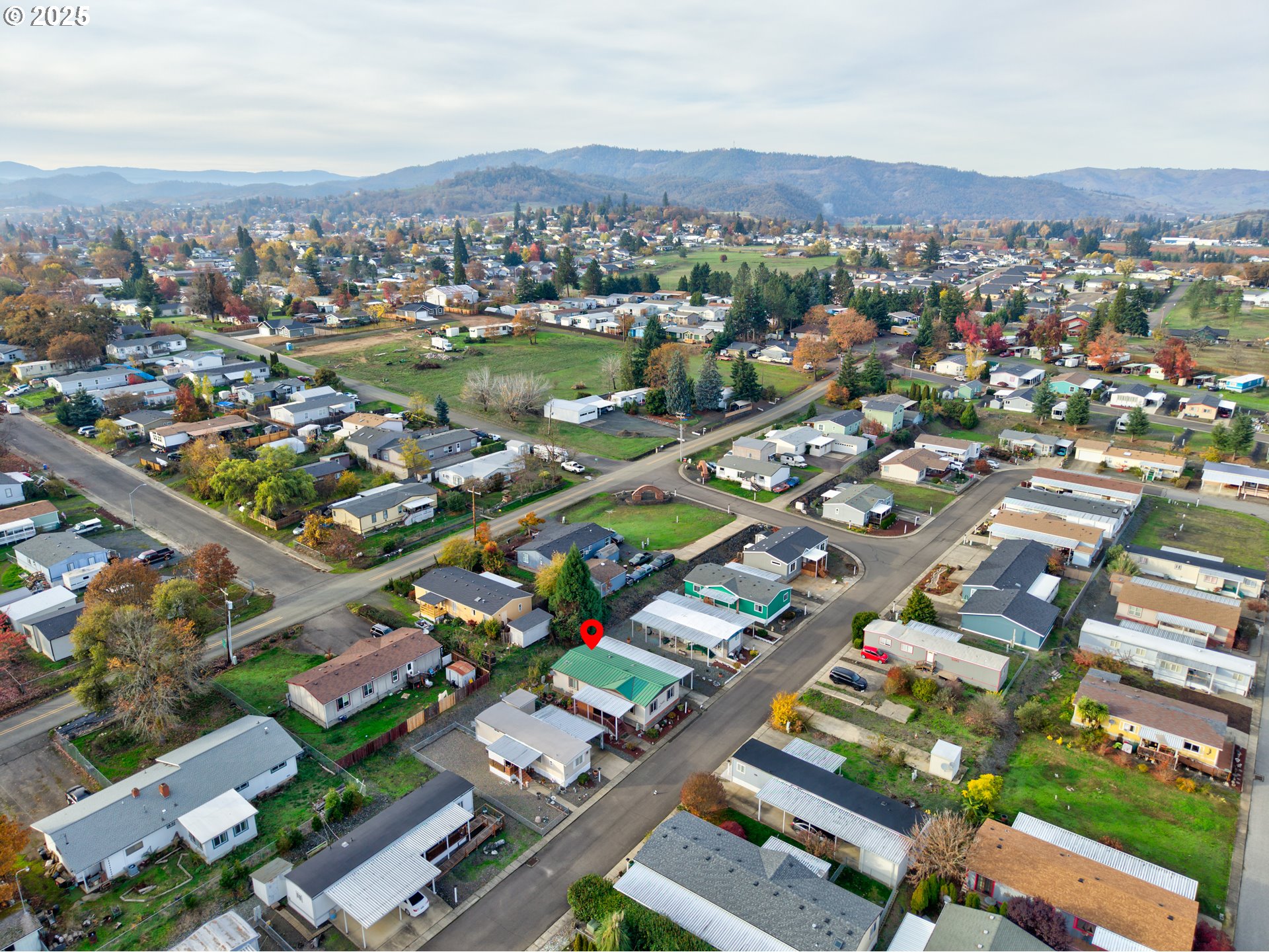 125 Estate Loop Winston, OR 97496 - Photo 37 of 45 an aerial view of residential houses with outdoor space
