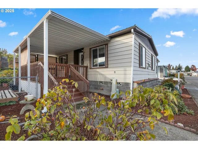 a view of a house with wooden fence