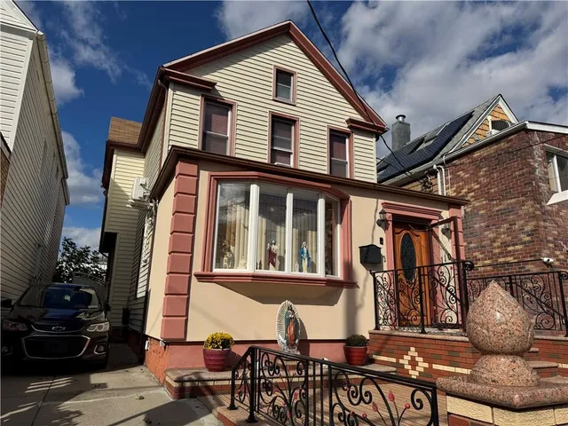 a front view of a house with sitting space