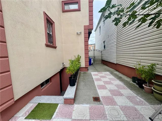 a view of a backyard with sitting area