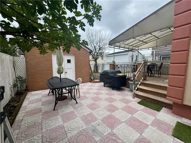 a house view with a sitting space and garden space