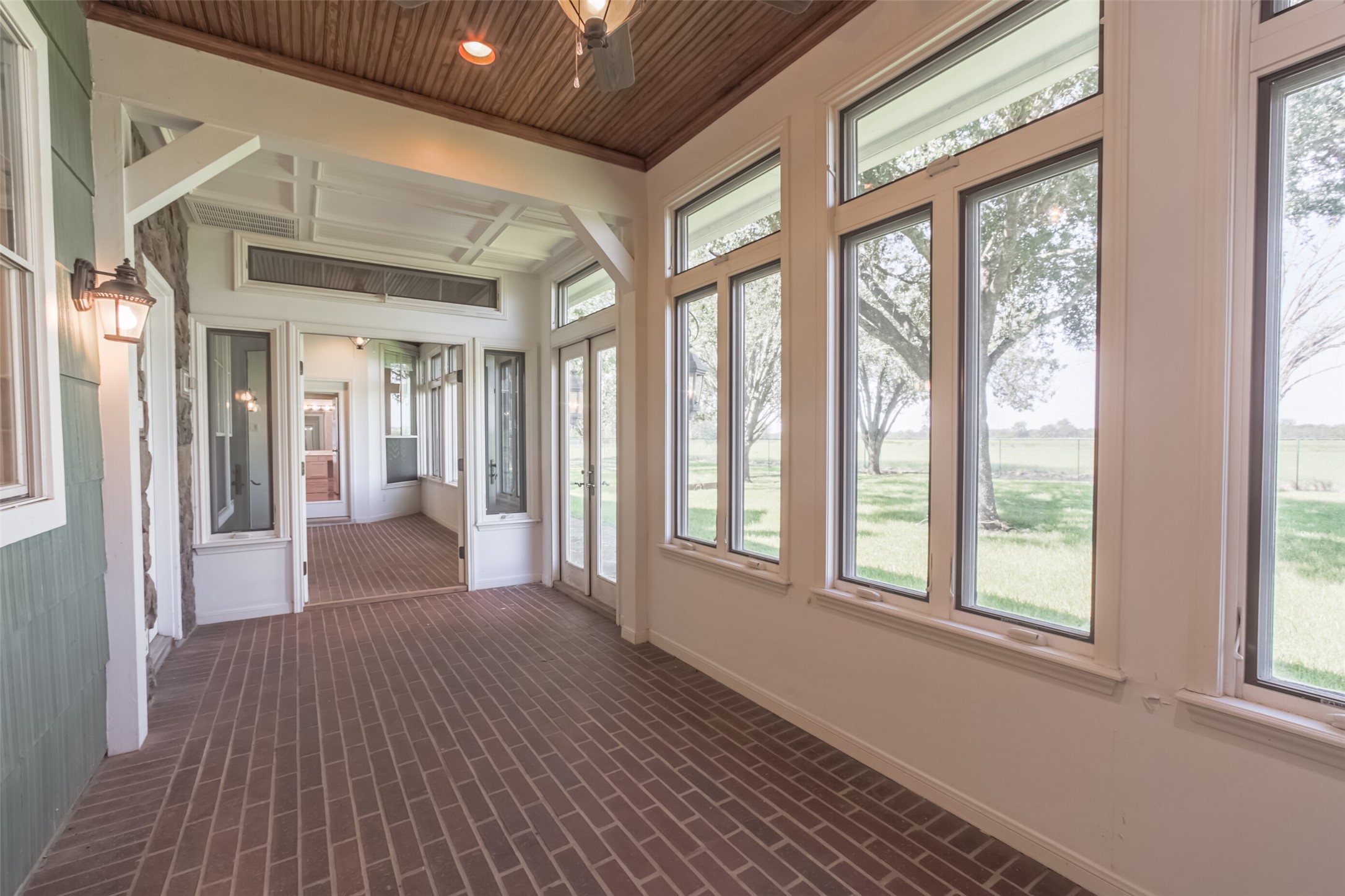 4903 Bowser Road Fulshear, TX 77441 - Photo 32 of 50 Climate conditioned back porch with brick pavers and beadboard ceiling