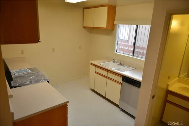 a bathroom with a sink a mirror and a toilet
