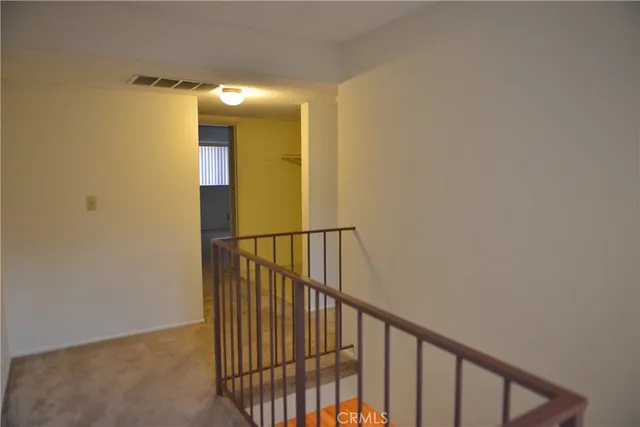a view of hallway with stairs
