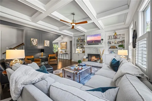 a living room with furniture fireplace and a fireplace