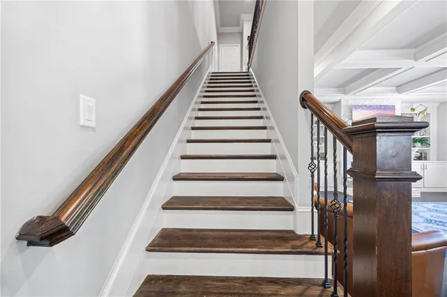 a view of a hallway with a livingroom and entryway