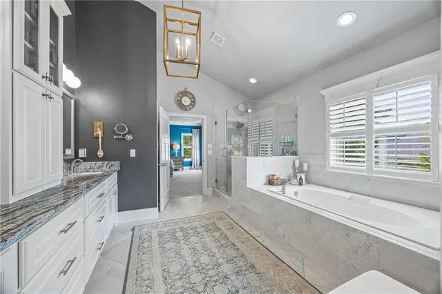 a bathroom with a sink vanity and mirror