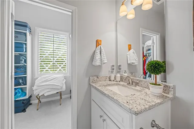 a bedroom with furniture and a rug