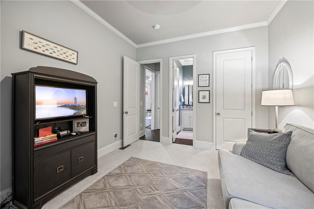 3111 Old Thompson Mill Road Buford, GA 30519 - Photo 39 of 52 a living room with furniture and a flat screen tv
