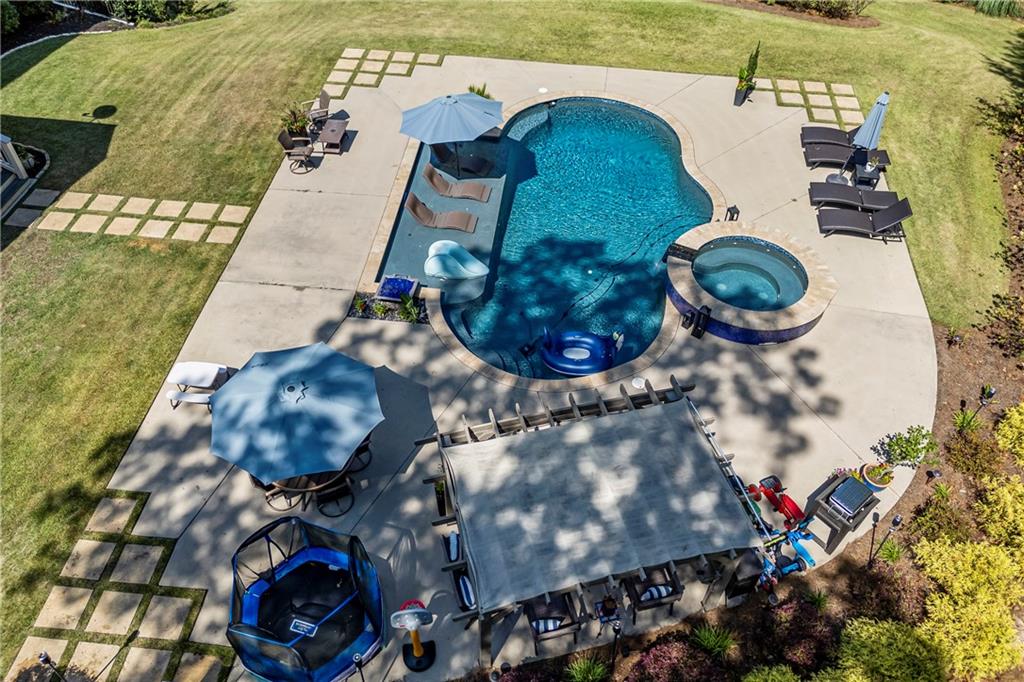 3111 Old Thompson Mill Road Buford, GA 30519 - Photo 43 of 52 an aerial view of a house with a yard and fountain in front of it