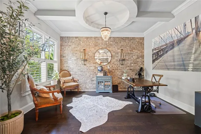 a living room with furniture a rug and a chandelier