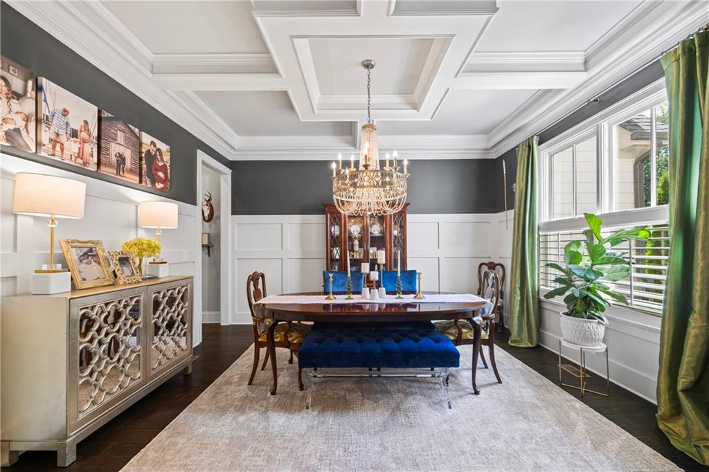 3111 Old Thompson Mill Road Buford, GA 30519 - Photo 9 of 52 a bed room with furniture and a chandelier