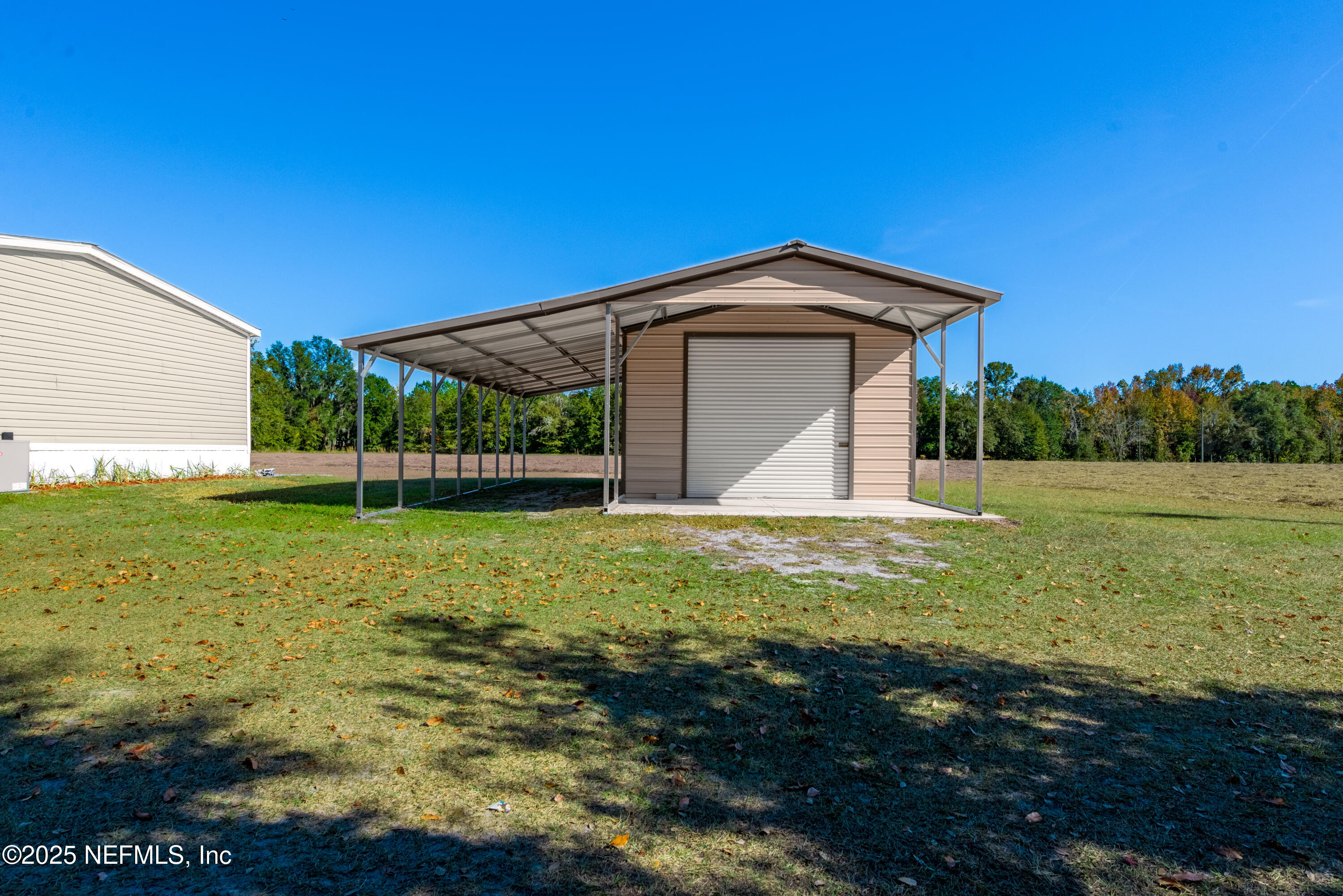 10379 Southwest 45th Place Lake Butler, FL 32054 - Photo 20 of 24 a view of a tiny house with yard and a garden