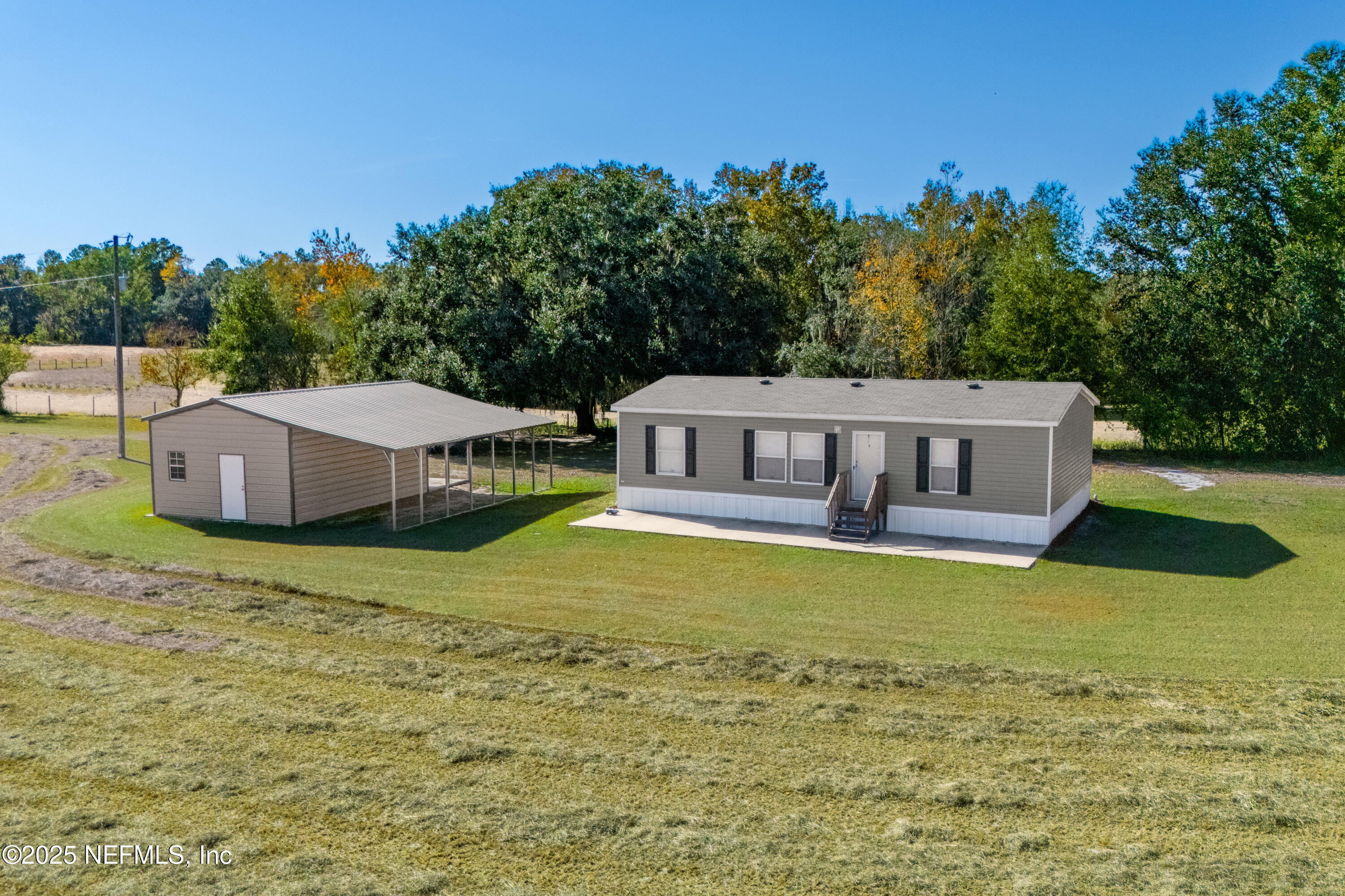 10379 Southwest 45th Place Lake Butler, FL 32054 - Photo 2 of 24 a house view with a outdoor space