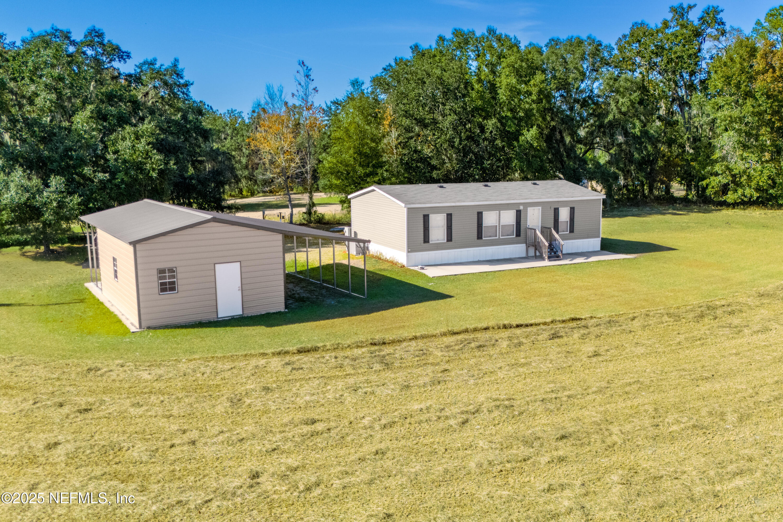 10379 Southwest 45th Place Lake Butler, FL 32054 - Photo 4 of 24 a view of a house with a yard