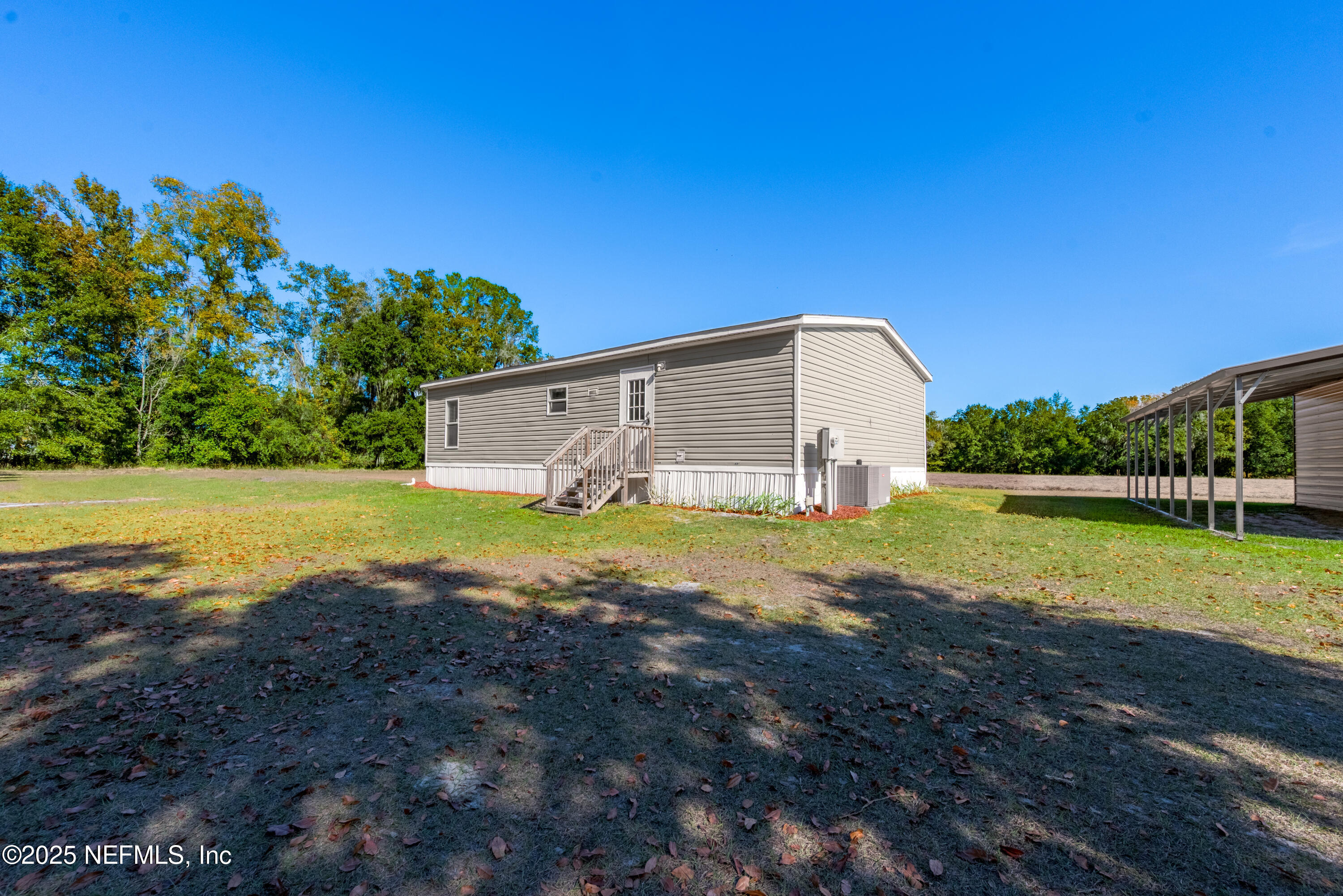 10379 Southwest 45th Place Lake Butler, FL 32054 - Photo 5 of 24 a view of a house with a yard