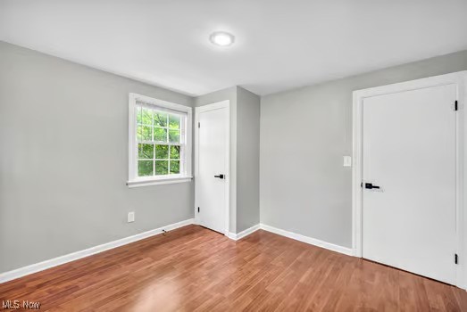 22790 Chardon Road Euclid, OH 44117 - Photo 14 of 35 Empty room featuring hardwood / wood-style floors