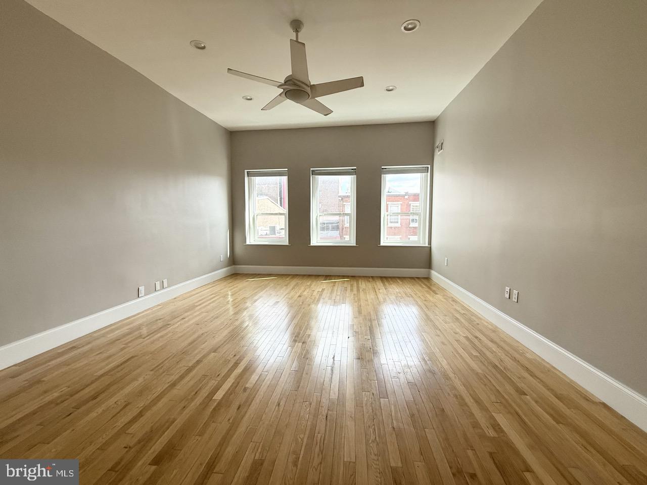 26 North 3rd Street, Unit 3 Philadelphia, PA 19106 - Photo 19 of 50 an empty room with wooden floor and windows