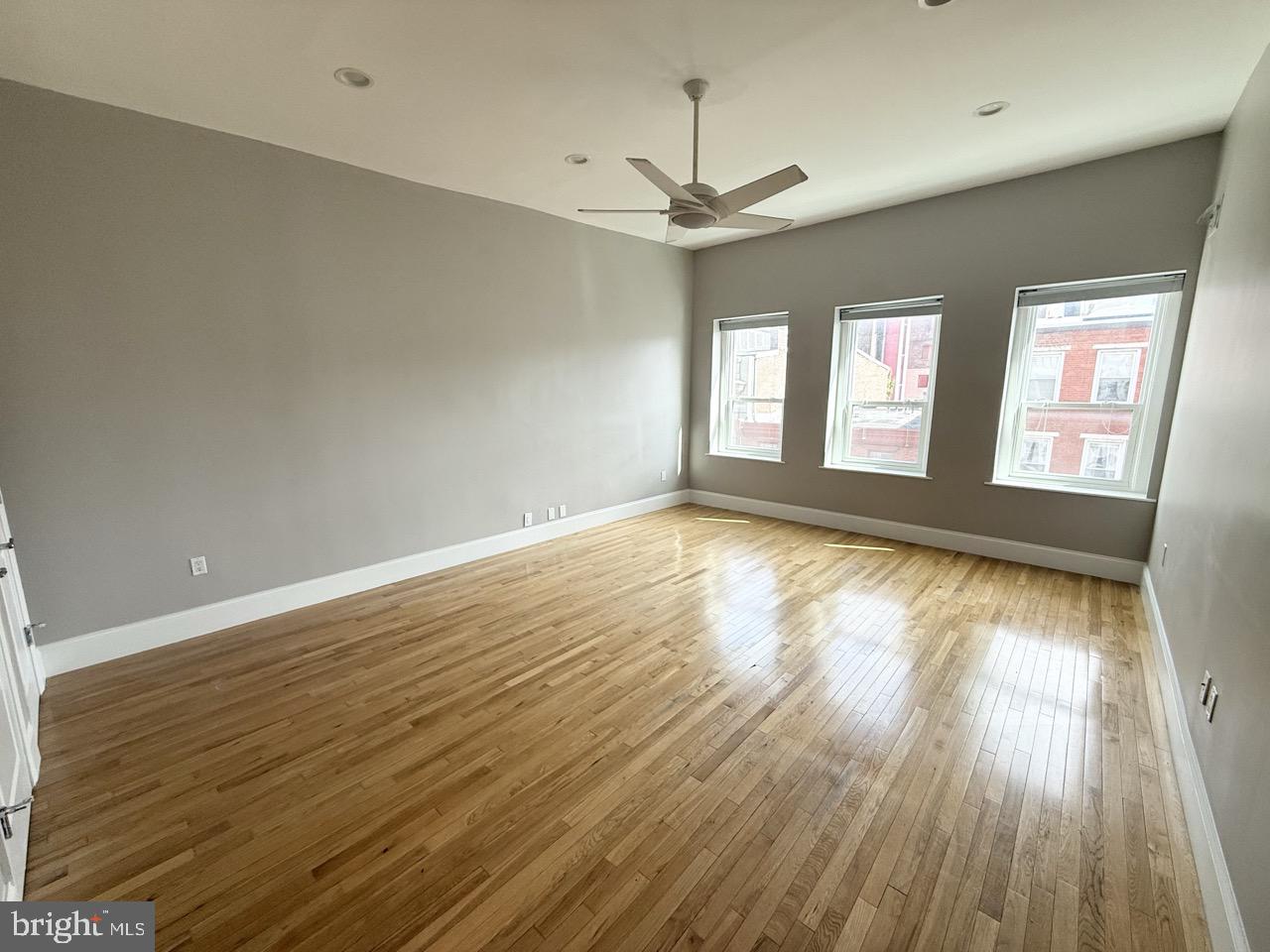 26 North 3rd Street, Unit 3 Philadelphia, PA 19106 - Photo 20 of 50 an empty room with wooden floor and windows