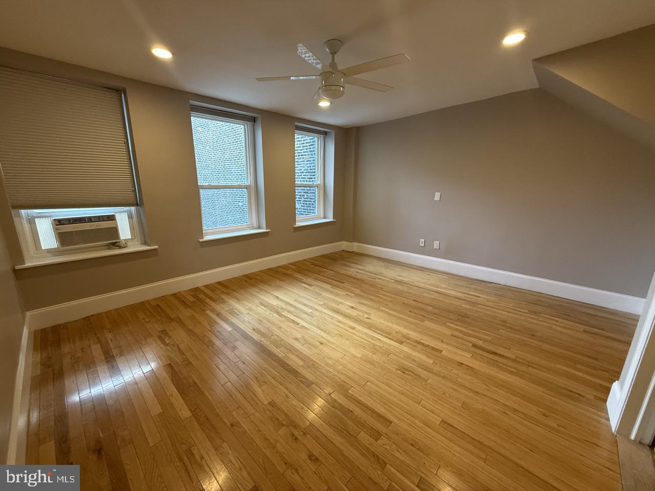 26 North 3rd Street, Unit 3 Philadelphia, PA 19106 - Photo 32 of 50 an empty room with wooden floor and windows