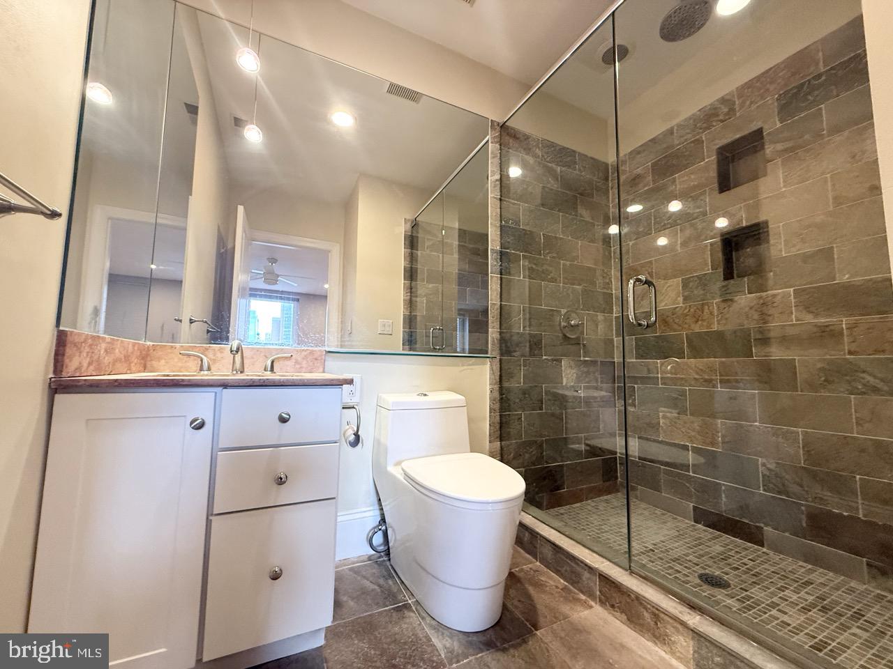 26 North 3rd Street, Unit 3 Philadelphia, PA 19106 - Photo 33 of 50 a bathroom with a shower a toilet and sink