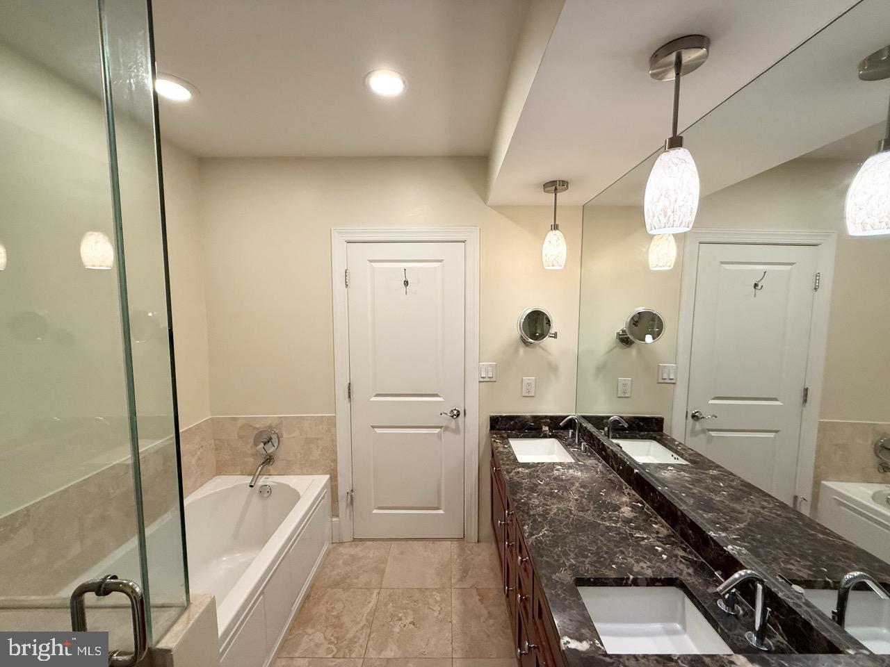 26 North 3rd Street, Unit 3 Philadelphia, PA 19106 - Photo 35 of 50 a bathroom with a tub a sink and a shower