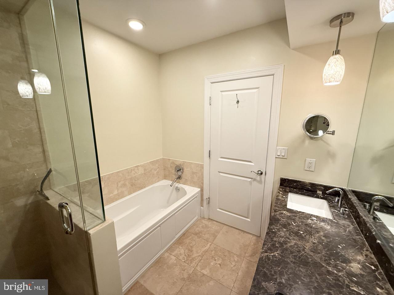 26 North 3rd Street, Unit 3 Philadelphia, PA 19106 - Photo 36 of 50 a bathroom with a tub a sink and a shower