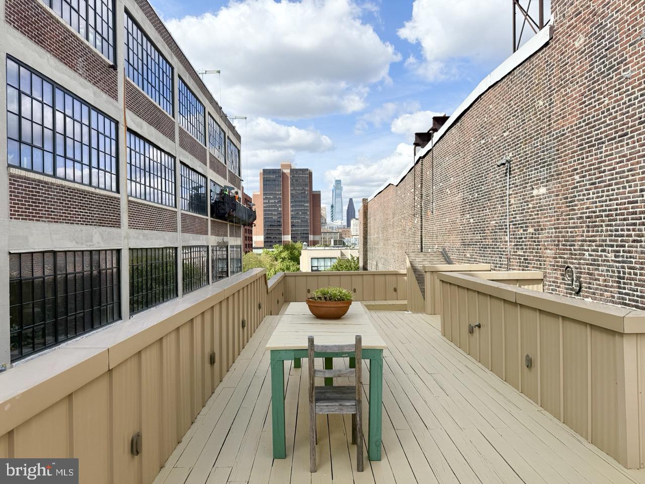 26 North 3rd Street, Unit 3 Philadelphia, PA 19106 - Photo 41 of 50 a view of balcony with barbeque grill and wooden floor