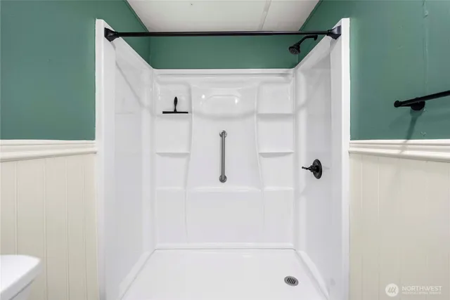 a bathroom with a bathtub and a shower
