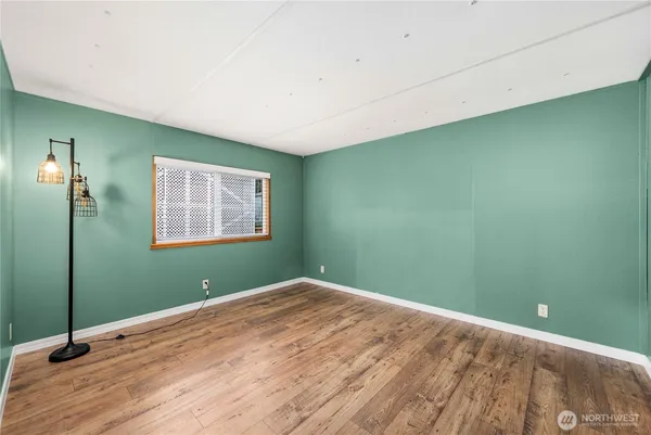 a view of a room that has a large window