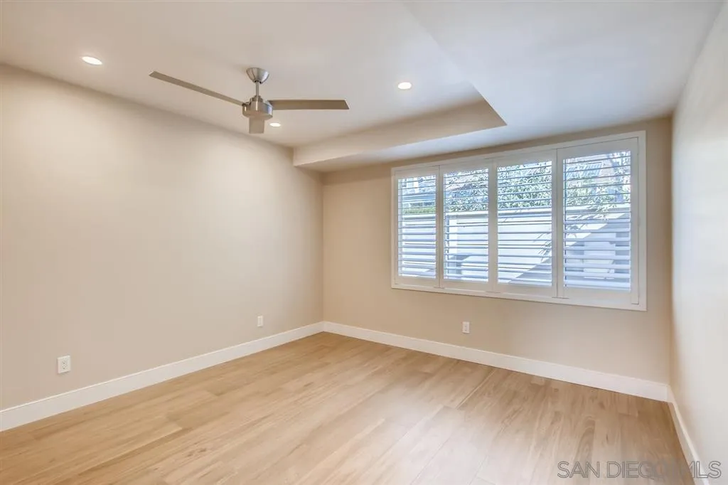 1765 Tattenham Road Encinitas, CA 92024 - Photo 11 of 25 an empty room with wooden floor and windows