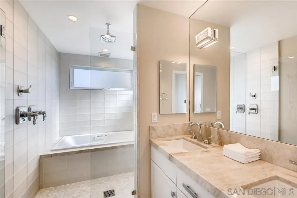 1765 Tattenham Road Encinitas, CA 92024 - Photo 13 of 25 a bathroom with a granite countertop sink mirror and double