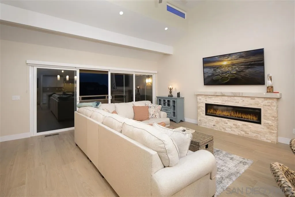 1765 Tattenham Road Encinitas, CA 92024 - Photo 24 of 25 a living room with furniture fireplace and flat screen tv